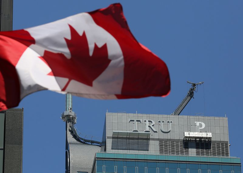 &copy; Reuters. Workers remove letters from the &quot;TRUMP&quot; sign on top of the Trump International Hotel and Tower in Toronto