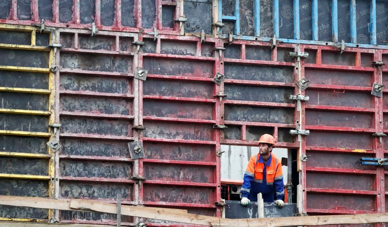 &copy; Reuters. A worker looks on at a construction site in Moscow