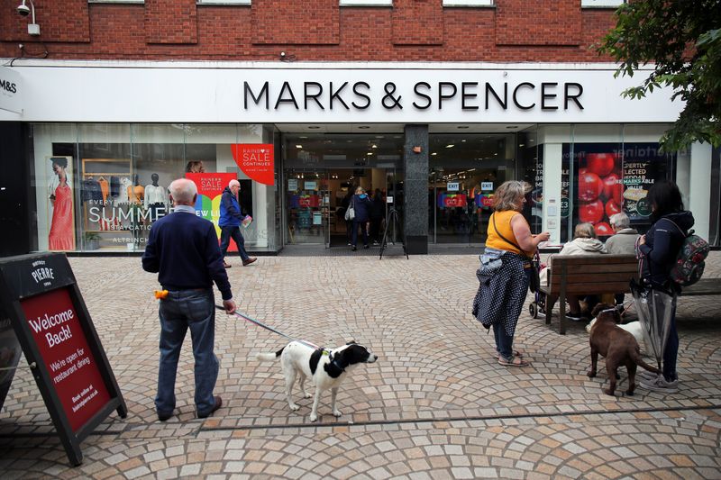 &copy; Reuters. FILE PHOTO: People are seen outside a Marks and Spencer (M&amp;S) store, in Altrincham