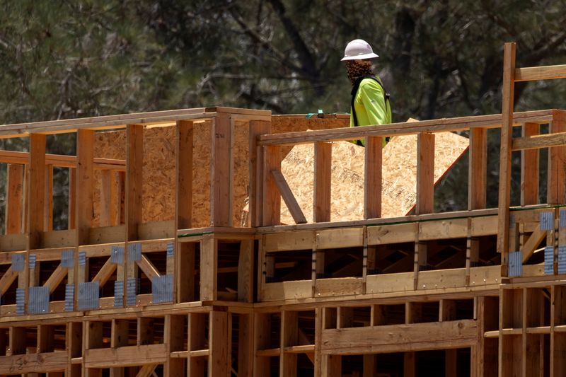 &copy; Reuters. FILE PHOTO: A construction worker on the job at a residential project during the outbreak of the coronavirus disease in California