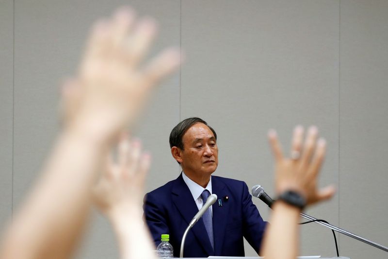 &copy; Reuters. 経済は持ち直しの動き＝株価のコロナ前水準回復で官房長官