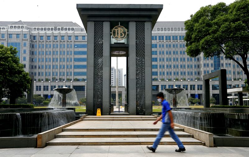 &copy; Reuters. A man walks past Bank Indonesia headquarters