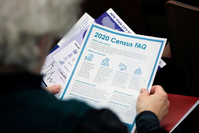 &copy; Reuters. FILE PHOTO: A person holds census information at an event where U.S. Rep. Alexandria Ocasio-Cortez (D-NY) spoke at a Census Town Hall at the Louis Armstrong Middle School in Queens, New York City