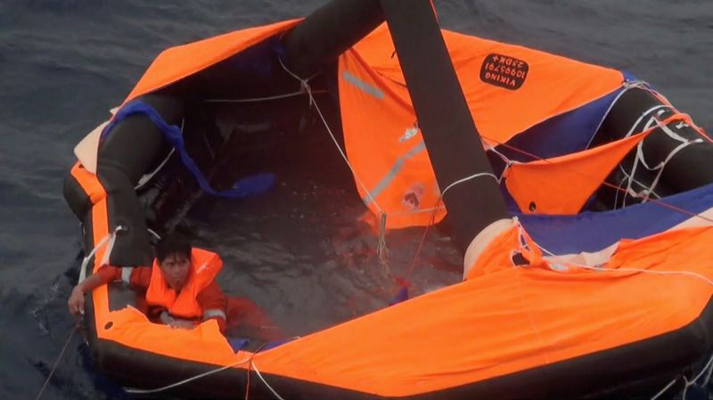 &copy; Reuters. Filipino crew member of Gulf Livestock 1 is rescued by Japan Coast Guard crew on vessel Kaimon, at the East China Sea