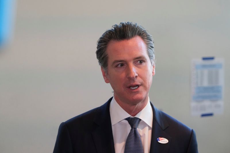 © Reuters. California's Governor Gavin Newsom speaks to the media after casting his vote at a voting center at The California Museum for the presidential primaries on Super Tuesday in Sacramento