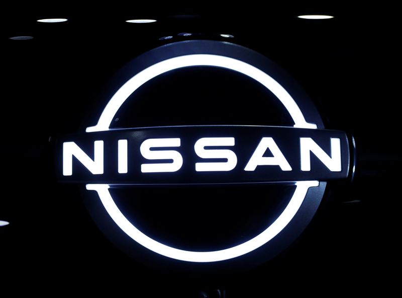 © Reuters. The brand logo of Nissan Motor Corp. is seen at the front nose section of the company's new Ariya all-battery SUV during a press preview in Yokohama
