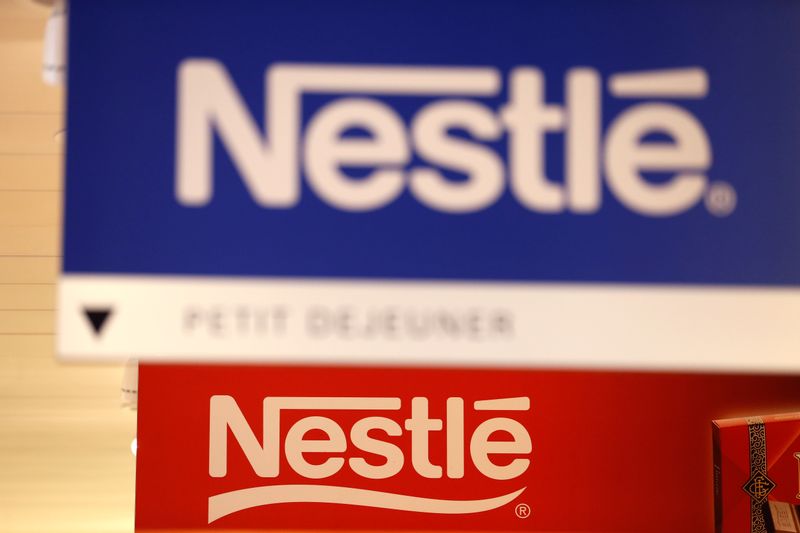 © Reuters. Nestle logos are pictured in the supermarket of Nestle headquarters in Vevey