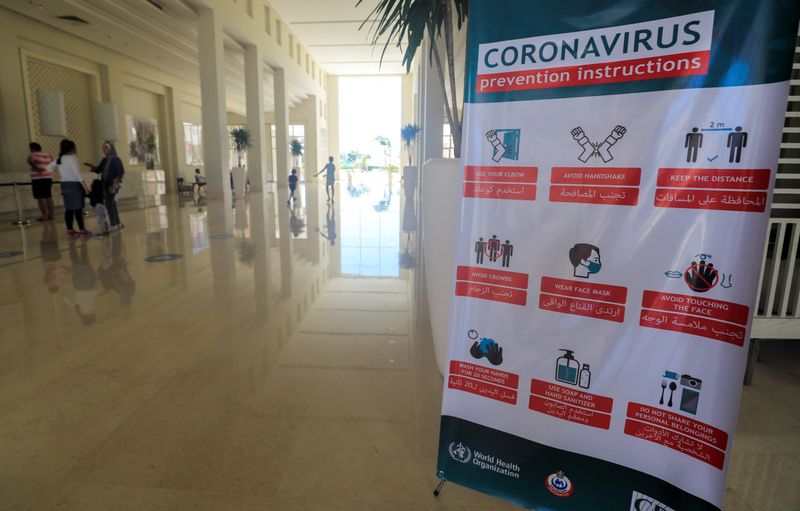 &copy; Reuters. FILE PHOTO:  A sign of instruction for coronavirus is seen at Jaz Aquaviva Hotel as people arrive for a summer vacation at a Red Sea resort, amid the coronavirus disease (COVID-19) pandemic, in Hurghada