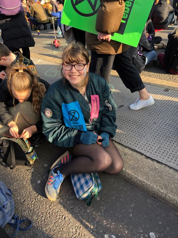 &copy; Reuters. Teen climate activist Blue Sandford, author of the book &quot;Challenge Everything&quot;, and her father Roc Sandford attend the Extinction Rebellion occupation of Blackfriars Bridge in London