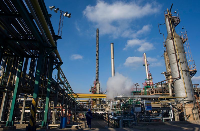 &copy; Reuters. FILE PHOTO: Worker walks at Repsol YPF&apos;s refinery plant in Cartagena