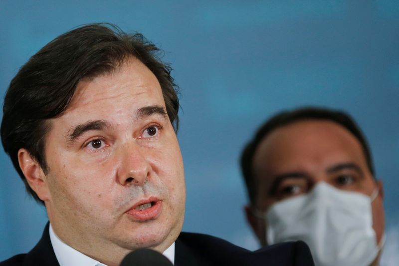 &copy; Reuters. President of Brazil&apos;s Lower House Rodrigo Maia speaks next to Government Secretary Jorge Antonio de Oliveira Francisco during a news conference after receiving the administrative reform bill at the National Congress in Brasilia
