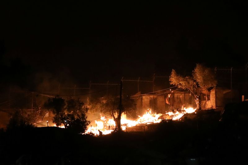 &copy; Reuters. Flames rise as a fire burns at the Moria camp for refugees and migrants on the island of Lesbos