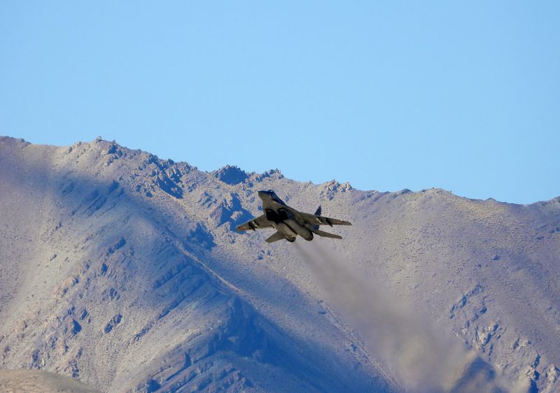 &copy; Reuters. An Indian fighter plane flies over a mountain range in Leh