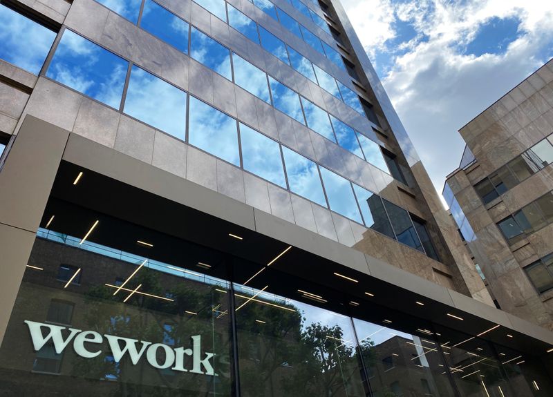 &copy; Reuters. The logo of WeWork is seen in the window of a building in London