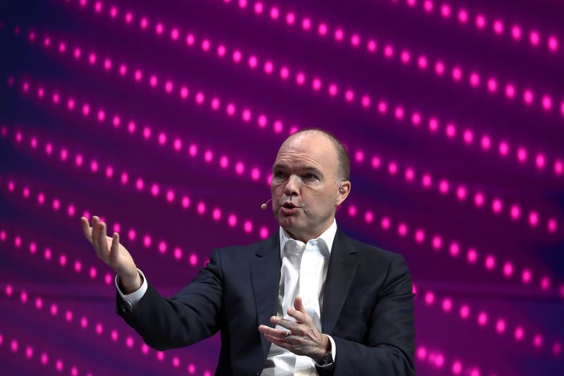 &copy; Reuters. FILE PHOTO: Nick Read, CEO of Vodafone, gestures as he speaks during the Mobile World Congress in Barcelona