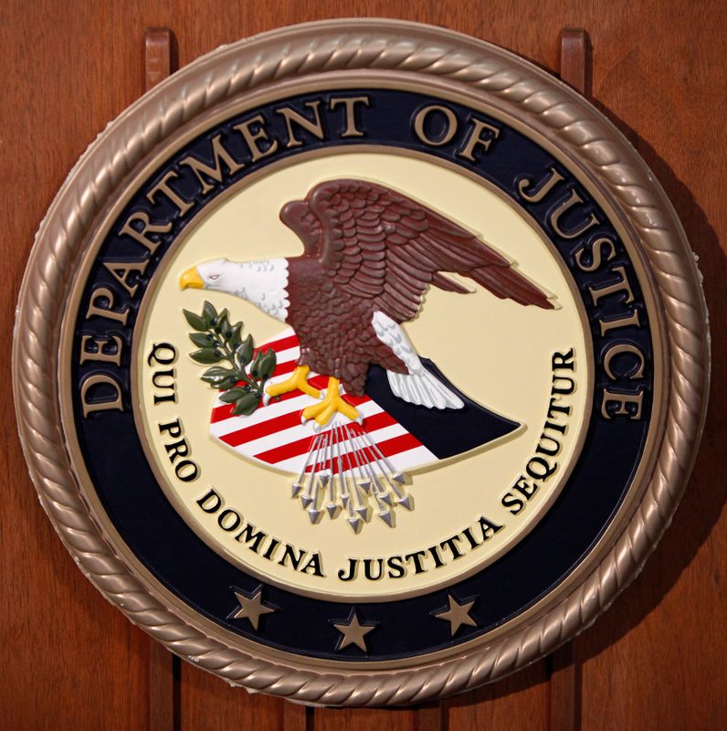 &copy; Reuters. FILE PHOTO:  The Department of Justice logo is seen on the podium during a news conference on the Gozi Virus in New York
