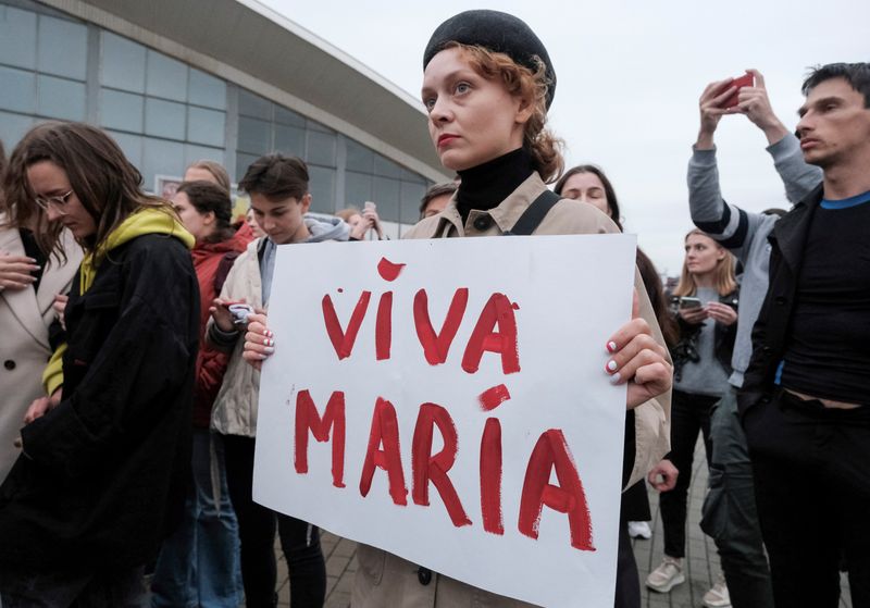 © Reuters. FILE PHOTO: An activist attends a rally in support of detained Belarusian opposition leader Maria Kolesnikova in Minsk