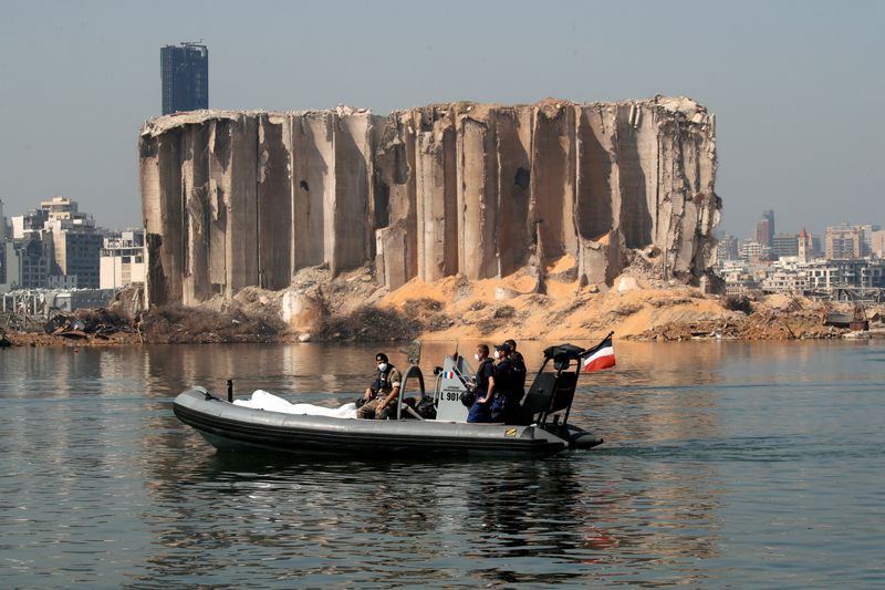 &copy; Reuters. FILE PHOTO: Members of the Lebanese army and the French military ride a boat past the damaged grain silo near site of the massive blast in Beirut&apos;s port area, in Beirut, Lebanon August 31, 2020.