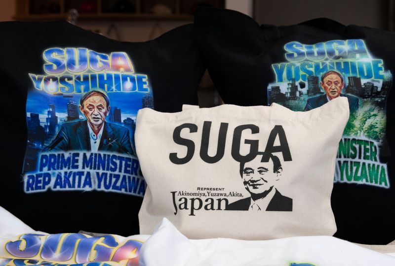 &copy; Reuters. Merchandise featuring Japan&apos;s expected new prime minister Yoshihide Suga are displayed at a store in Yuzawa