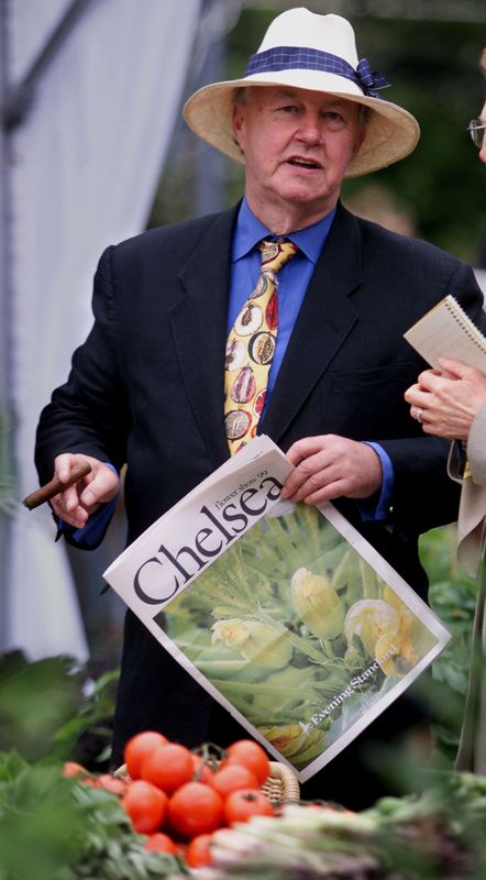 &copy; Reuters. FILE PHOTO: Terence Conran smokes a cigar at the chelsea flower show