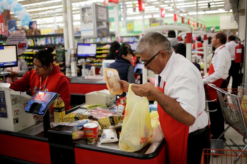 &copy; Reuters. A man packs goods in a supermarket in Ciudad Juarez