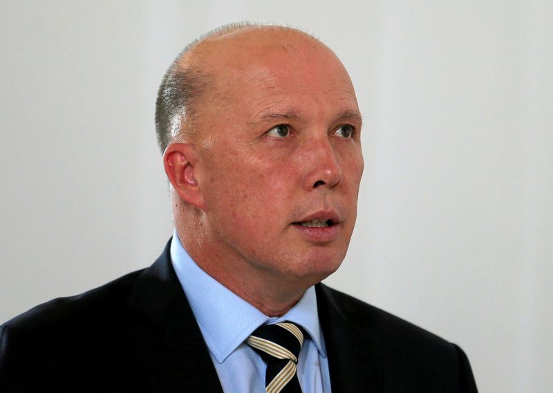 &copy; Reuters. FILE PHOTO: Australian Minister of Home Affairs Peter Dutton inspects St. Sebastian&apos;s Church where two Australian citizens died in the Easter Sunday bombing, during his visit to Negombo