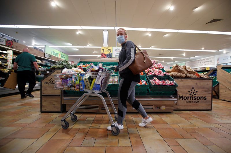 &copy; Reuters. A customer wearing a protective face mask shops at a Morrisons store in St Albans