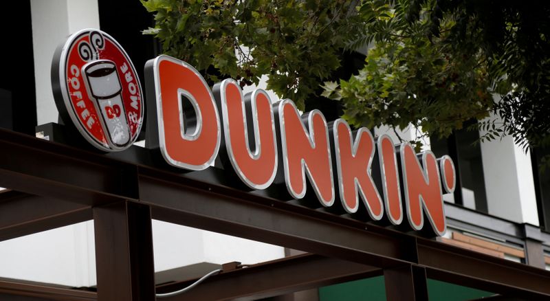 &copy; Reuters. FILE PHOTO: The sign of a Dunkin&apos; store, the first since a rebranding by the Dunkin&apos; Donuts chain, is pictured ahead of its opening in Pasadena