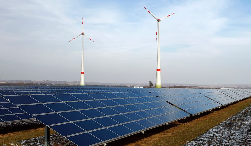 &copy; Reuters. A view of power generating wind turbines and solar panels near Mainz