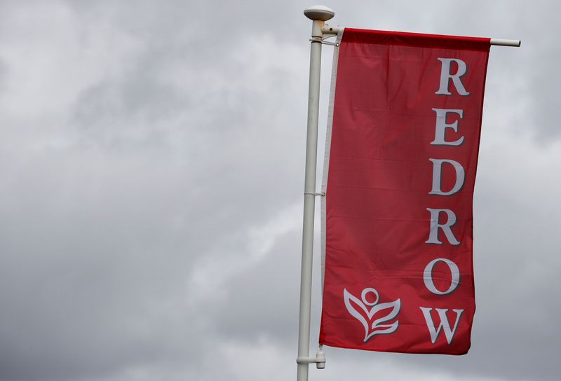 &copy; Reuters. The company logo of construction company Redrow is pictured on a flag at a new housing development near Manchester northern England.