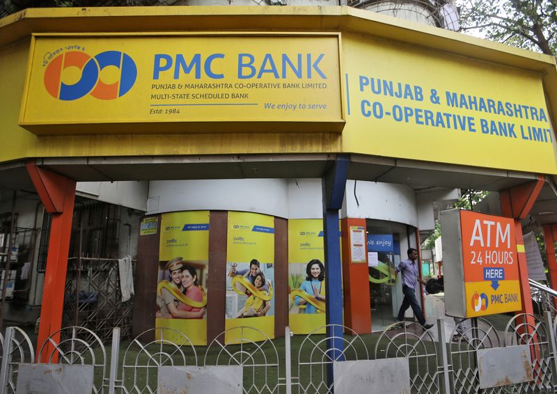 &copy; Reuters. FILE PHOTO: A man walks out from a Punjab and Maharashtra Co-operative Bank branch in Mumbai