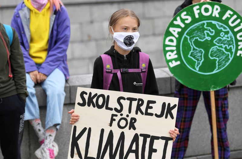 &copy; Reuters. FILE PHOTO: Swedish climate activist Greta Thunberg holds a poster reading &quot;School strike for Climate&quot;, in Stockholm