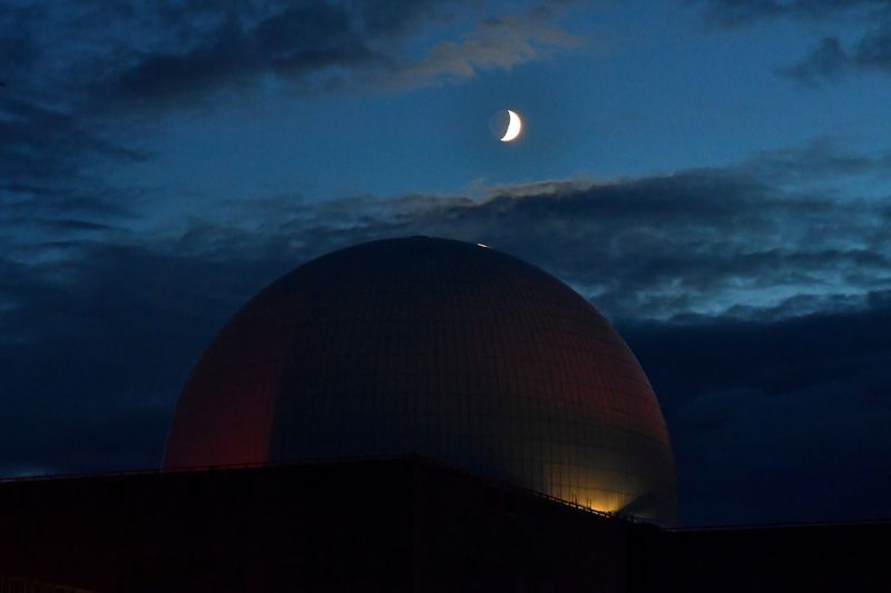 &copy; Reuters. FILE PHOTO: The moon is seen above Sizewell Nuclear Power Station in Sizewell