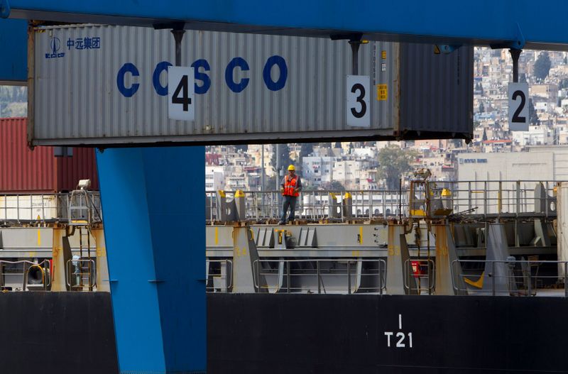 &copy; Reuters. FILE PHOTO: A container is unloaded from a cargo ship at the Haifa Port, Israel