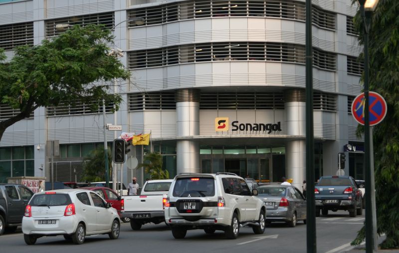 &copy; Reuters. FILE PHOTO: A man walks past the head office of Angola&apos;s state oil company Sonangol in the capital Luanda, Angola