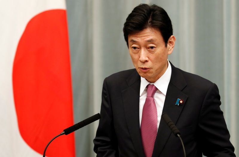 &copy; Reuters. Japan&apos;s Minister in charge of economic revitalisation and measures for the novel coronavirus pandemic Yasutoshi Nishimura attends a news conference in Tokyo