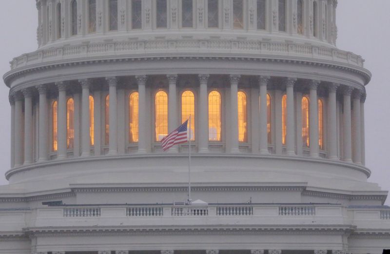 &copy; Reuters. FILE PHOTO: A United States flag flies in front of the U.S. Capitol dome at sunrise  in Washington