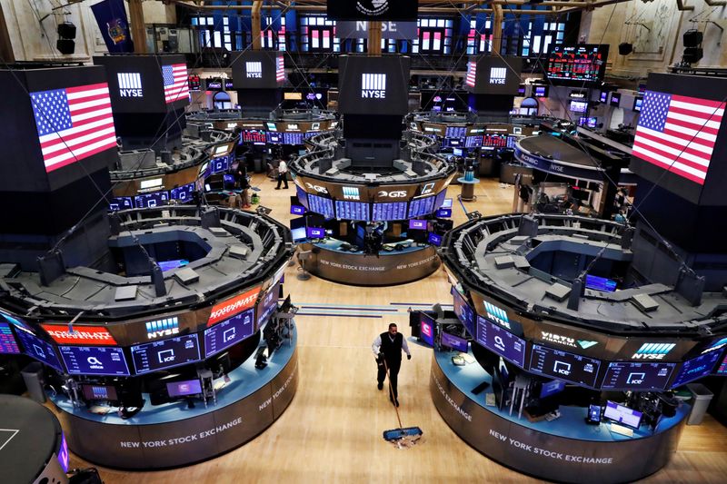 &copy; Reuters. FILE PHOTO: A worker cleans the floor of the New York Stock Exchange (NYSE)