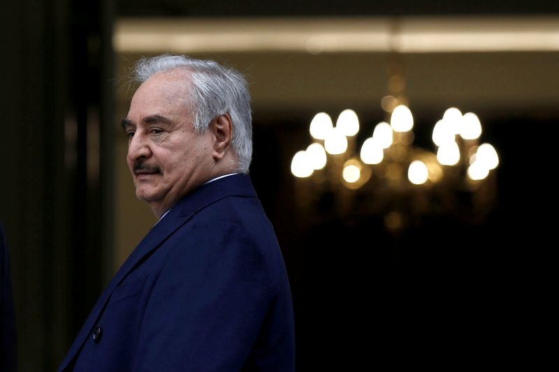 &copy; Reuters. Greek Foreign Minister Nikos Dendias welcomes Libyan commander Khalifa Haftar at the Foreign Ministry in Athens