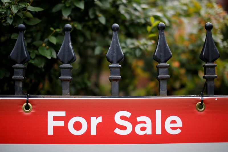 &copy; Reuters. FILE PHOTO: A real estate sign is seen hanging on a fence in front of a house for sale in Ottawa