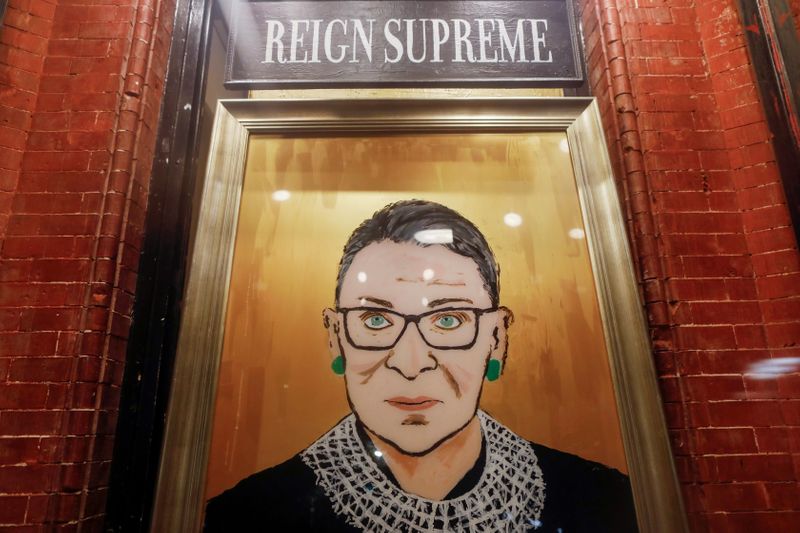 © Reuters. A painting is seen in a storefront on Broadway of Associate Justice of the Supreme Court of the United States Ruth Bader Ginsburg who passed away in Manhattan, New York City