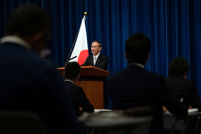 &copy; Reuters. Yoshihide Suga speaks during a news conference following his confirmation as Prime Minister of Japan in Tokyo