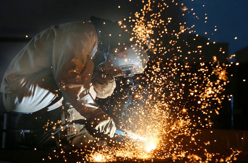 &copy; Reuters. Worker works on a production line at a factory of a ship equipments manufacturer, in Nantong, Jiangsu