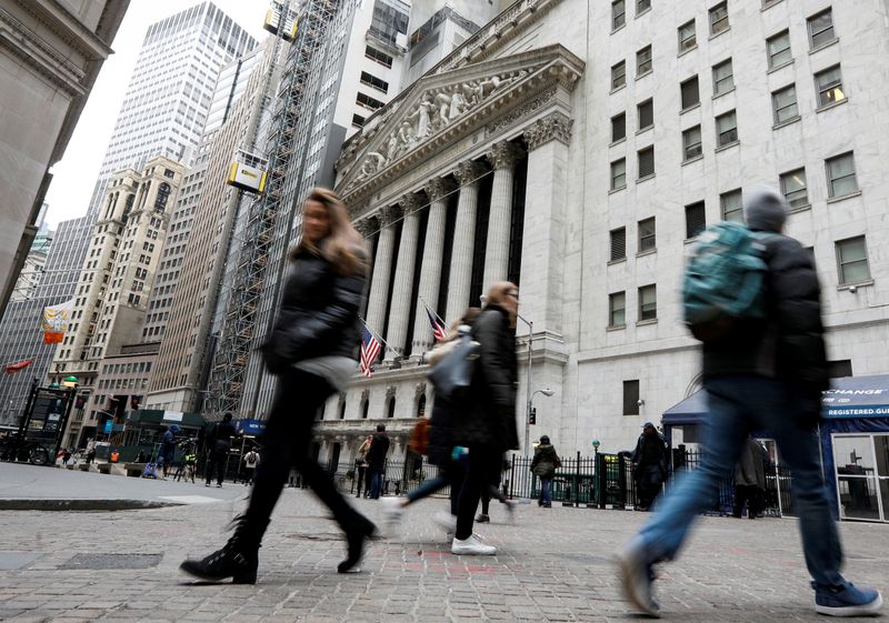 &copy; Reuters. People walk on Wall St. in front of the NYSE in New York