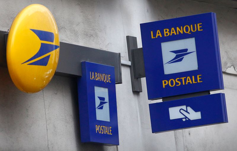 © Reuters. Signs for La Banque Postale are seen outside a Post Office in Paris
