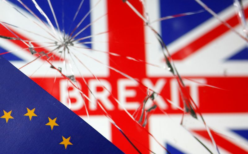&copy; Reuters. EU flag are placed on broken glass and British flag in this illustration picture taken