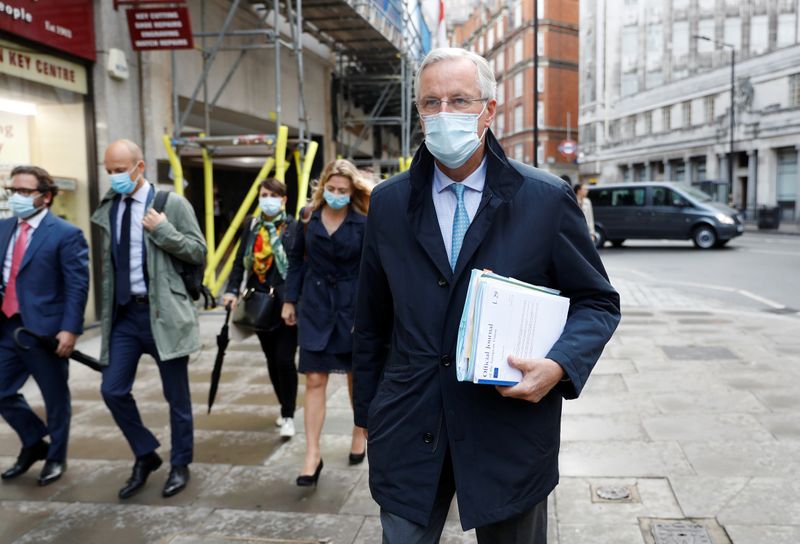 &copy; Reuters. EU chief negotiator Michel Barnier wearing a protective mask leaves his hotel in London