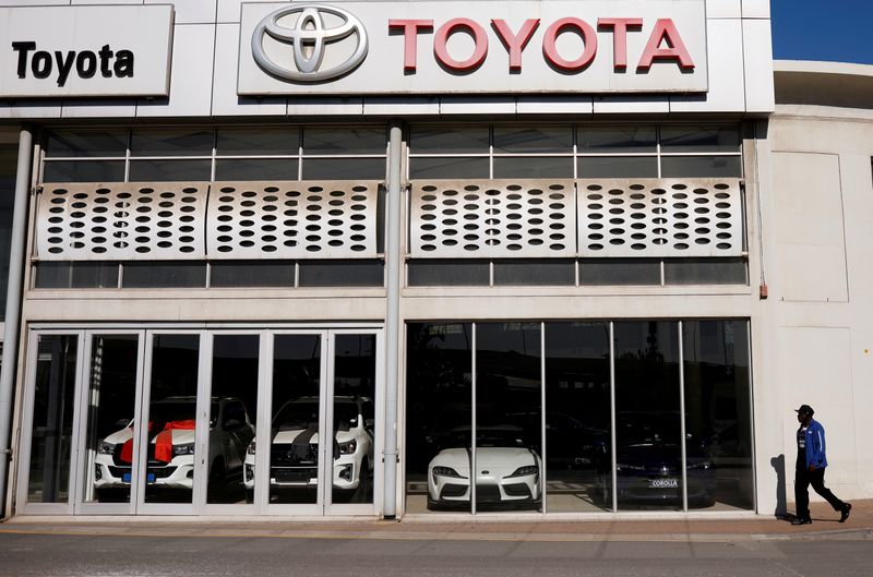 &copy; Reuters. FILE PHOTO: A man walks past a closed Toyota car dealership during the coronavirus disease (COVID-19) nationwide lockdown in Cape Town