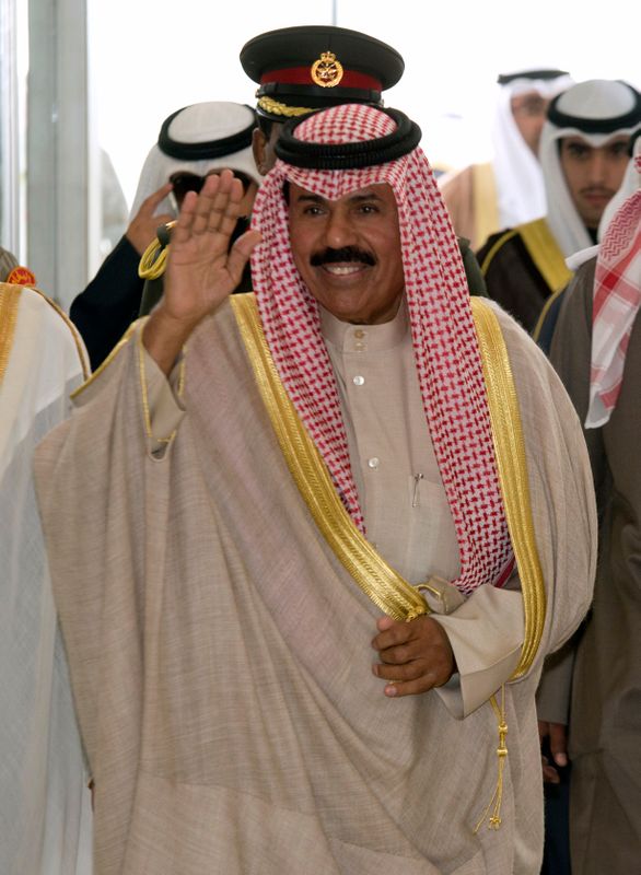 © Reuters. Kuwait's Crown Prince Sheikh Nawaf al-Ahmad al-Sabah waves as he arrives for the opening session of Parliament in Kuwait City