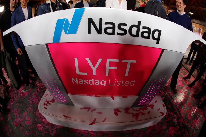 © Reuters. The Lyft logo is shown following the Lyft listing on the Nasdaq at an IPO event in Los Angeles,